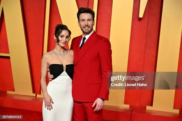 Alba Baptista and Chris Evans attend the 2024 Vanity Fair Oscar Party Hosted By Radhika Jones at Wallis Annenberg Center for the Performing Arts on...