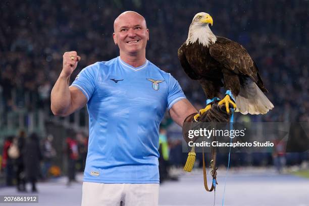 The "Olympia" Eagle of SS Lazio and its falconer Bernabe Juan under prior to the Serie A TIM match between SS Lazio and Udinese Calcio at Stadio...