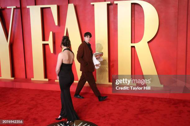 Ezra Koenig attends the 2024 Vanity Fair Oscar Party hosted by Radhika Jones at Wallis Annenberg Center for the Performing Arts on March 10, 2024 in...