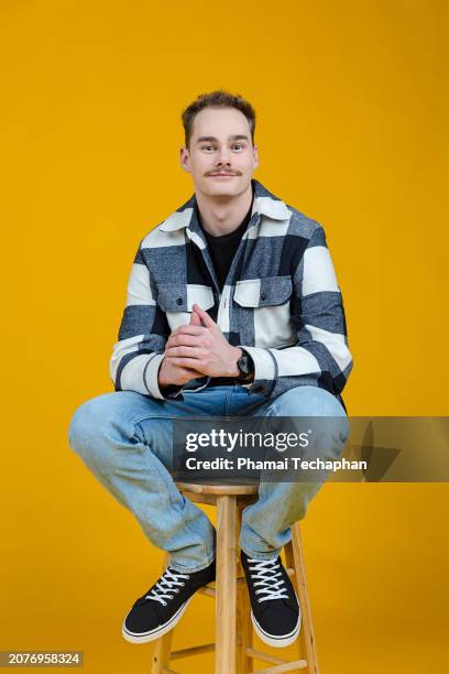 happy man in front of plain background - checked shirt stock pictures, royalty-free photos & images