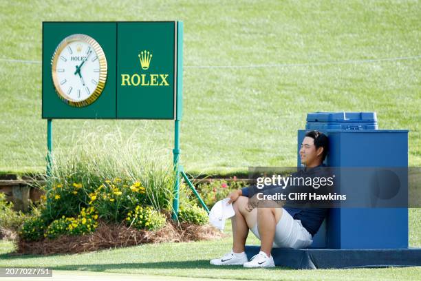 Tom Kim of South Korea sits on the 18th tee prior to THE PLAYERS Championship at TPC Sawgrass on March 11, 2024 in Ponte Vedra Beach, Florida.