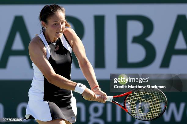 Daria Kasatkina of Russia returns a shot to Sloane Stephens of the United States during the BNP Paribas Open at Indian Wells Tennis Garden on March...