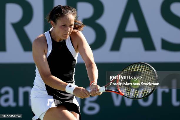 Daria Kasatkina of Russia returns a shot to Sloane Stephens of the United States during the BNP Paribas Open at Indian Wells Tennis Garden on March...