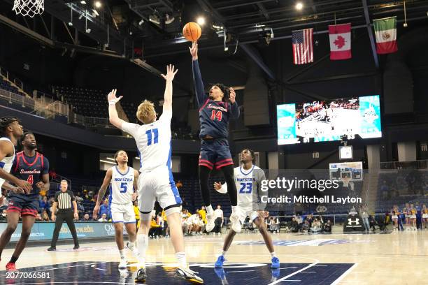 Tyler Stephenson-Moore of the Stony Brook Seawolves takes a shot over Jacco Fritz of the Hofstra Pride in the second half during the semifinal round...