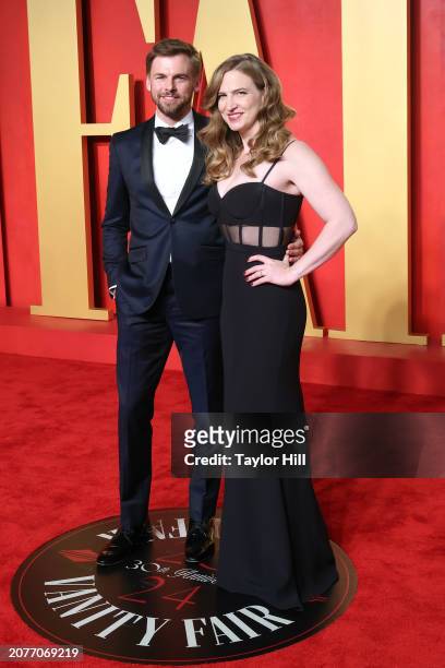 Tommy Dewey and Helen Estabrook attend the 2024 Vanity Fair Oscar Party hosted by Radhika Jones at Wallis Annenberg Center for the Performing Arts on...