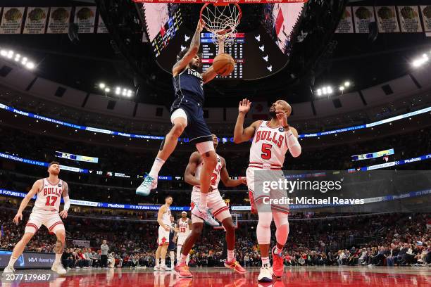 Dereck Lively II of the Dallas Mavericks dunks against the Chicago Bulls during the first half at the United Center on March 11, 2024 in Chicago,...