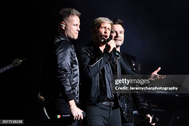 Nicky Byrne, Kian Egan, and Shane Filan of Westlife perform at Meridian Hall on March 11, 2024 in Toronto, Ontario.