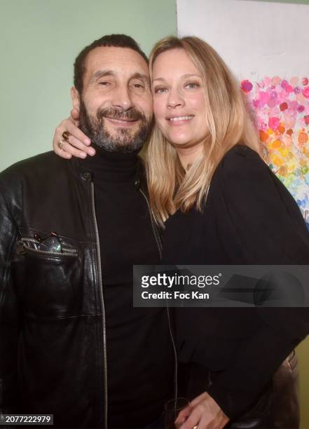 Painter Caroline Faindt and her companion actor Zinedine Soualem attend «Essentielle» Caroline Faindt's Preview at Wonder Nature on March 11, 2024 in...