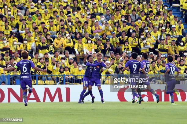 Sho Sasaki of Sanfrecce Hiroshima celebrates with teammates after scoring the team's first goal during the J.League J1 match between Kashiwa Reysol...