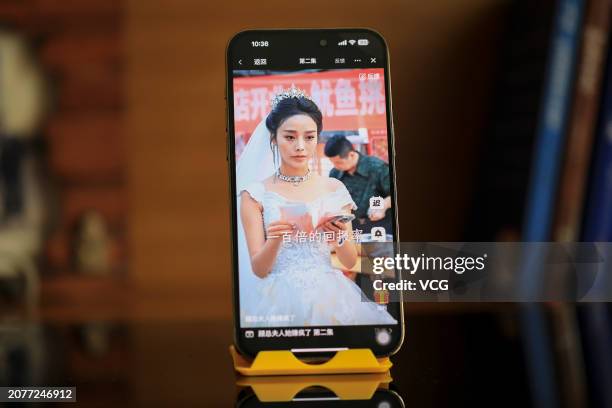 Citizen shows a screenshot of an online mini drama series on a mobile phone on March 12, 2024 in Shanghai, China.