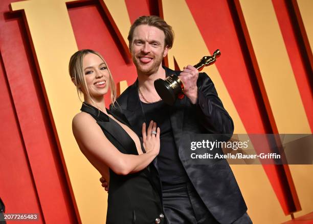 Claudia Sulewski and Finneas O'Connell attend the 2024 Vanity Fair Oscar Party hosted by Radhika Jones at Wallis Annenberg Center for the Performing...