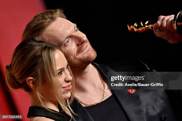 Claudia Sulewski and Finneas O'Connell attend the 2024 Vanity Fair Oscar Party hosted by Radhika Jones at Wallis Annenberg Center for the Performing...