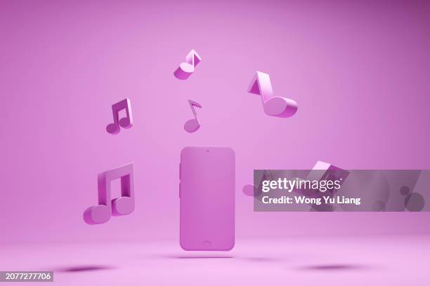 smartphone and music entertainment concept with pink background - mp3 player stock pictures, royalty-free photos & images