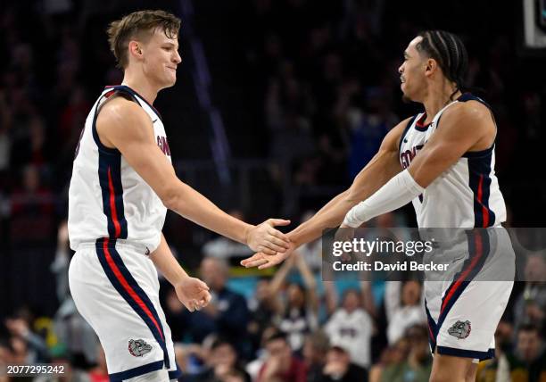 Ben Gregg and Ryan Nembhard of the Gonzaga Bulldogs celebrate after Gregg hit a 3-pointer against the San Francisco Dons in the second half of a...