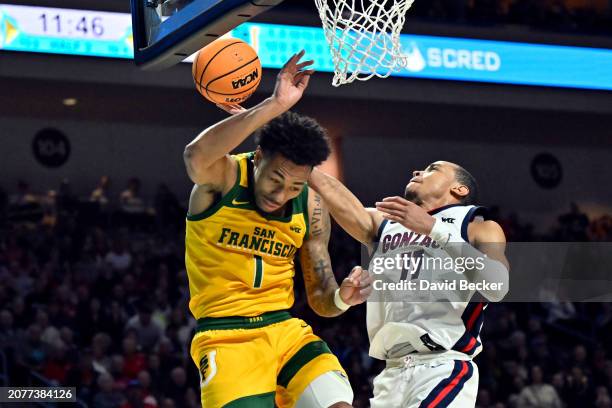 Nolan Hickman of the Gonzaga Bulldogs shoots over Malik Thomas of the San Francisco Dons in the second half of a semifinal game of the West Coast...