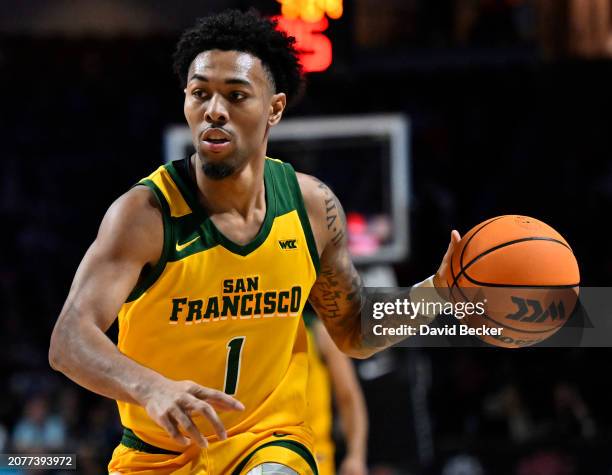 Malik Thomas of the San Francisco Dons drives the ball against the Gonzaga Bulldogs in the first half of a semifinal game of the West Coast...