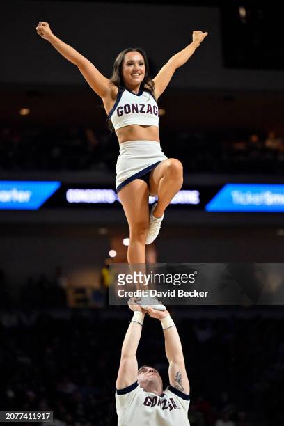 Members of the Gonzaga Bulldogs cheerleader squad perform during their team's semifinal game against the San Francisco Dons in the West Coast...