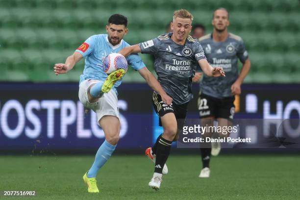 Steven Ugarkovic of Melbourne City and Oscar Priestman of the Wanderers contest the ball during the A-League Men round 12 match between Melbourne...