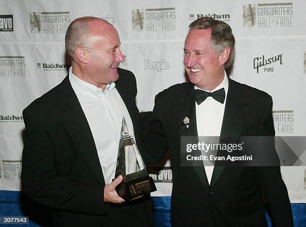 Musician Phil Collins and singer/songwriter Neil Sedaka pose in the press room at the Annual Songwriters Hall of Fame Awards ceremony and dinner at...