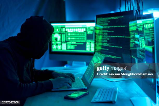 payments system hacking. online credit cards payment security concept. hacker in black gloves hacking the system. - android malware stock pictures, royalty-free photos & images