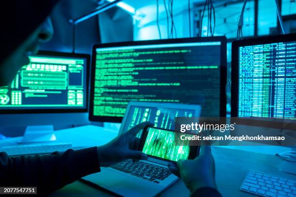 payments system hacking. online credit cards payment security concept. hacker in black gloves hacking the system. - android malware stockfoto's en -beelden