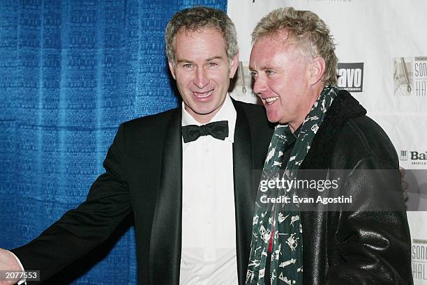 Tennis star John McEnroe and Queen drummer Roger Taylor pose in the press room at the Annual Songwriters Hall of Fame Awards ceremony and dinner at...