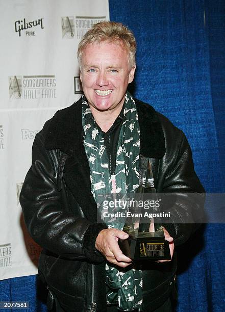 Queen drummer Roger Taylor poses in the press room at the Annual Songwriters Hall of Fame Awards ceremony and dinner at the Marriott Marquis June 12,...