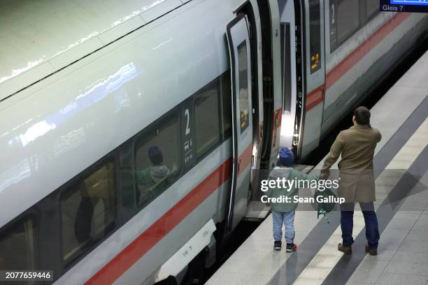 Father and son bid farewell to a relative at Hauptbahnhof main railway station at one of the few intercity trains of German state railway carrier...