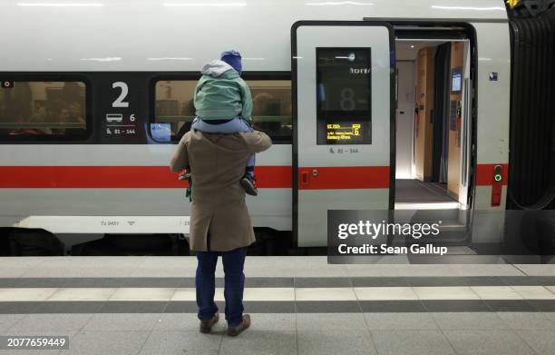 Father and son bid farewell to a relative at Hauptbahnhof main railway station at one of the few intercity trains of German state railway carrier...