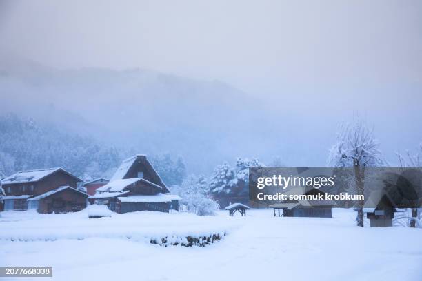 shirakawago village in snowfall day - snowfall in japan stock pictures, royalty-free photos & images