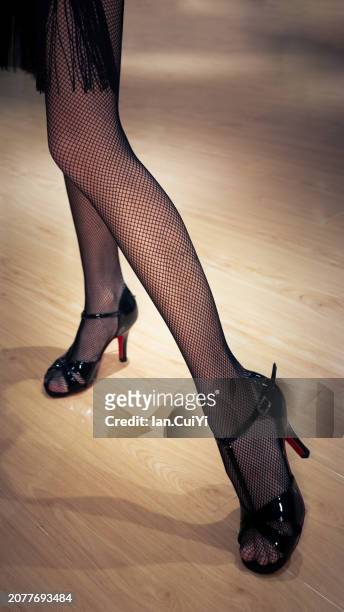 elegance captured: young woman's legs adorned for latin dance, beijing, china - swing dance stock pictures, royalty-free photos & images