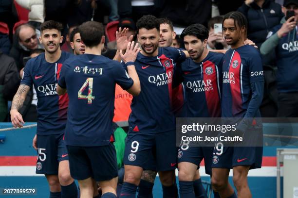 Goncalo Ramos of PSG celebrates his second goal with Carlos Soler, Bradley Barcola and teammates during the Ligue 1 Uber Eats match between Paris...