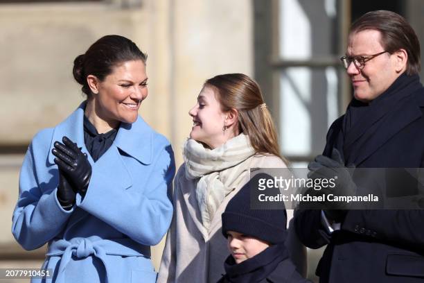Crown Princess Victoria of Sweden, Princess Estelle of Sweden, Prince Oscar of Sweden and Prince Daniel of Sweden react to the band of the guard of...