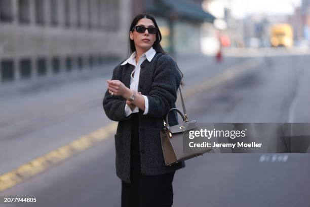 Tugba Kement seen wearing black sunglasses, Sézane dark grey wool knit long cardigan, white cotton buttoned shirt, COS black midi long skirt, Hermès...