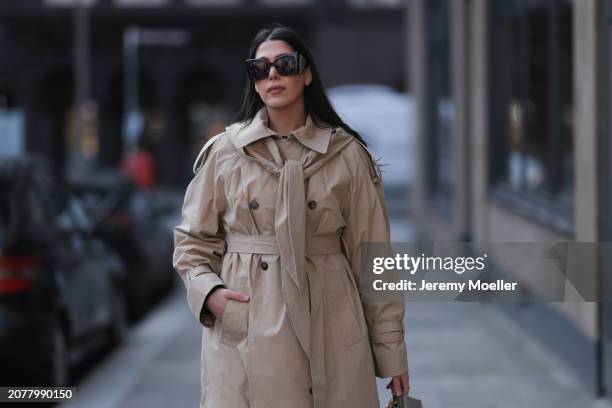 Tugba Kement seen wearing YSL black sunglasses and COS beige oversized long coat, on March 08, 2024 in Hamburg, Germany.