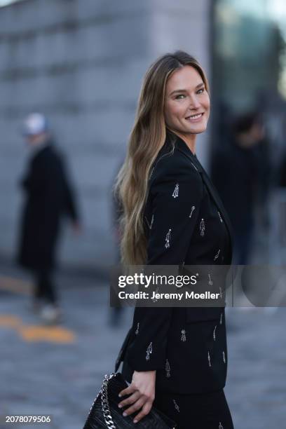 Bar Rafaeli seen wearing a black crystal decorated suit, black Stella McCartney bag, matching black pants and silver earrings outside Stella...