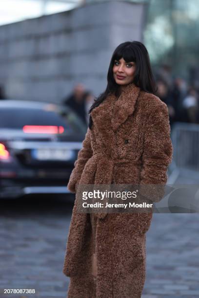 Jameela Jamil seen wearing a brown long teddy coat, beige over the knees boots, outside Stella McCartney show, during the Womenswear Fall/Winter...