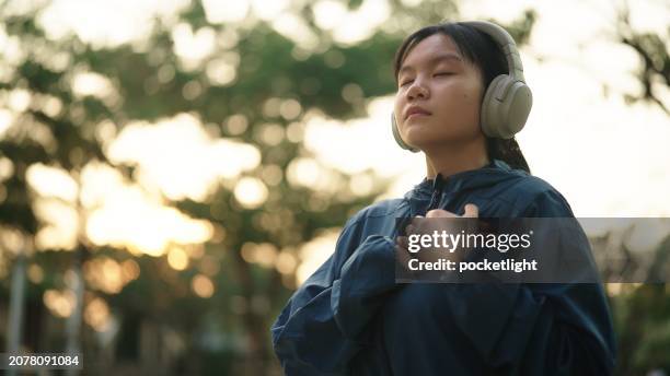 breathing inhaling at nature. - girl with hand on chest stock pictures, royalty-free photos & images
