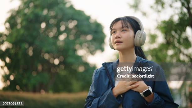 breathing inhaling at nature. - girl with hand on chest stock pictures, royalty-free photos & images