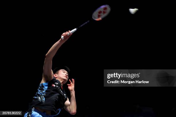 Li Shi Feng of China in action against Toma Junior Popov of France in the Men's Singles on during Day One of the Yonex All England Open Badminton...