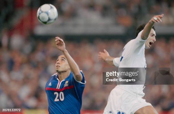 France footballer David Trezeguet and Italy footballer Mark Iuliano in action during the UEFA Euro 2000 final between France and Italy, at Stadion...