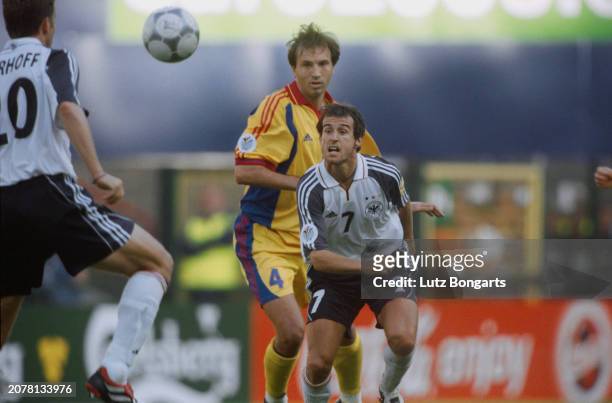 German footballer Oliver Bierhoff, Romanian footballer Iulian Filipescu and German footballer Mehmet Scholl in action during the UEFA Euro 2000 Group...