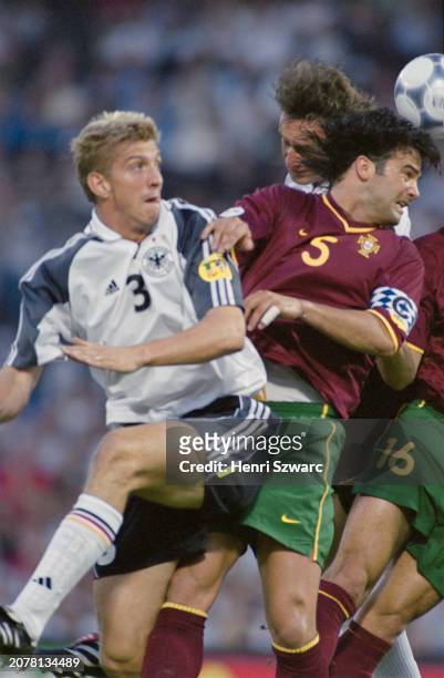 German footballer Marko Rehmer, Portugal footballer Fernando Couto, and German footballer Marco Bode in action during the UEFA Euro 2000 Group A...