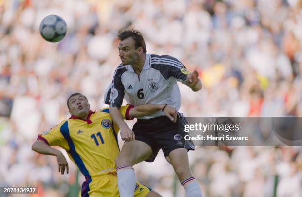 Romanian footballer Adrian Ilie and German footballer Jens Nowotny in action during the UEFA Euro 2000 Group A match between Germany and Romania, at...