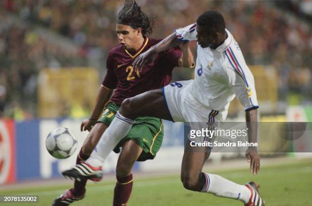 Portugal footballer Nuno Gomes and France footballer Marcel Desailly in action during UEFA Euro 2000 semifinal between France and Portugal, at the...