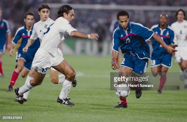 Italy footballer Alessandro Nesta and France footballer Thierry Henry in action during the UEFA Euro 2000 final between France and Italy, at Stadion...