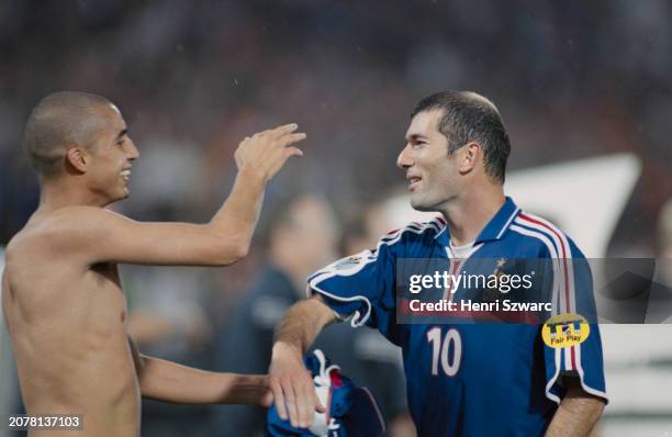 France footballers David Trezeguet and Zindine Zidane celebrate after the UEFA Euro 2000 final between France and Italy, at Stadion Feijenoord in...