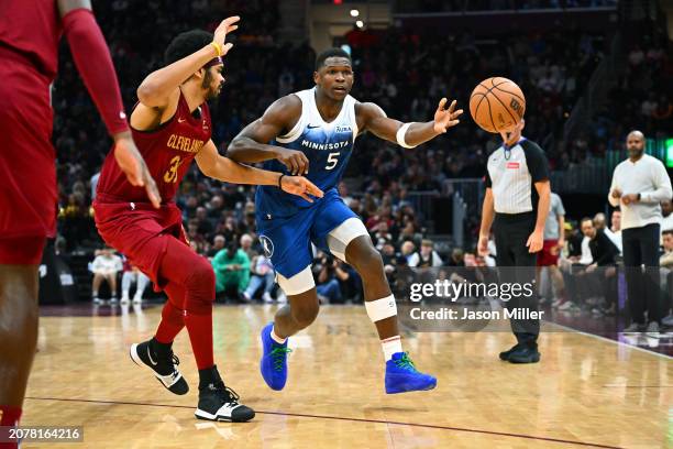 Jarrett Allen of the Cleveland Cavaliers guards Anthony Edwards of the Minnesota Timberwolves d4q at Rocket Mortgage Fieldhouse on March 08, 2024 in...