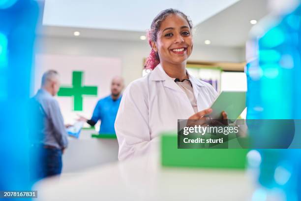 happy pharmacist portrait - shop assistant stock pictures, royalty-free photos & images