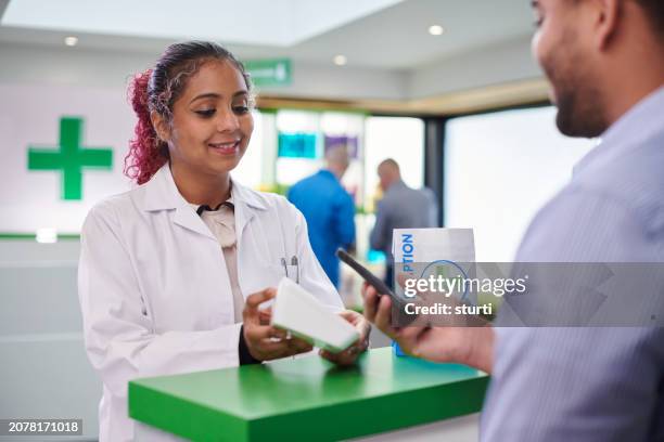 pharmacy payment by phone - pharmacist phone stock pictures, royalty-free photos & images